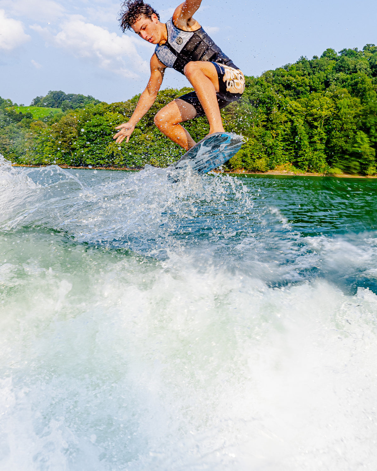 2027 Phase Five Key Jett Shreds wakesurf board action photo