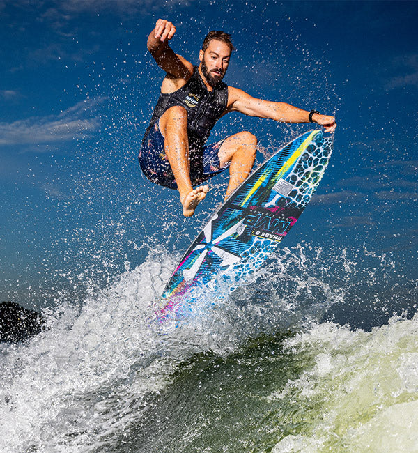 John Akerman wakesurfing on a Phase Five board
