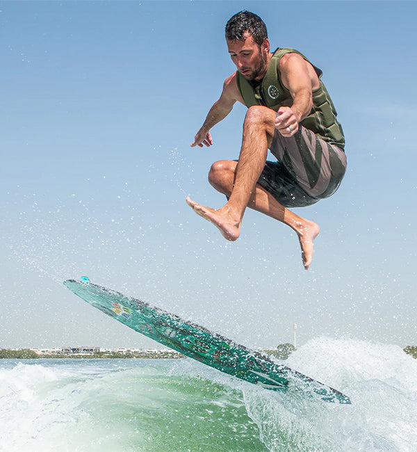 Anthony Edwards wakesurfing on a Phase Five board