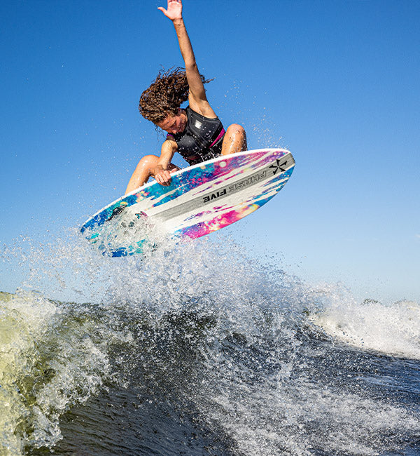 Bailey Rush wakesurfing on a Phase Five board