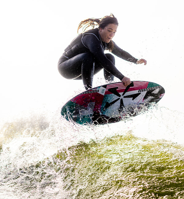 Jodi Grassman wakesurfing on a Phase Five board