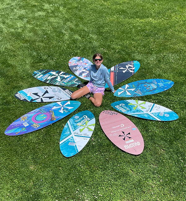 Kaelyn Hellemn wakesurfing on a Phase Five board