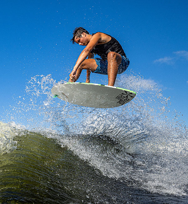 Reed Cole-Tucker wakesurfing on a Phase Five board
