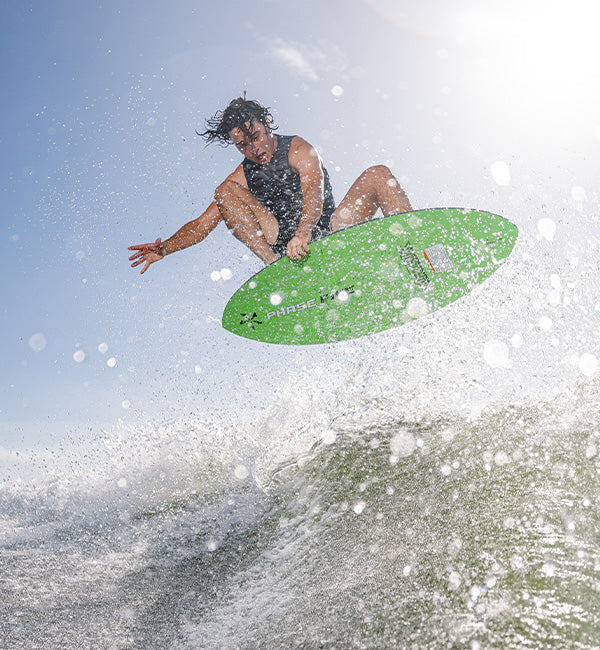 Rob McClelland wakesurfing on a Phase Five board