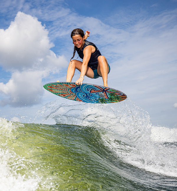 Whitley Stewart wakesurfing on a Phase Five Key Stewart Pro board