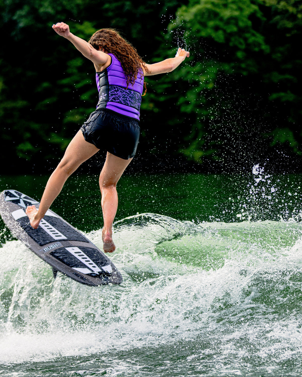 2027 Phase Five Rush Stealth wakesurf board action photo