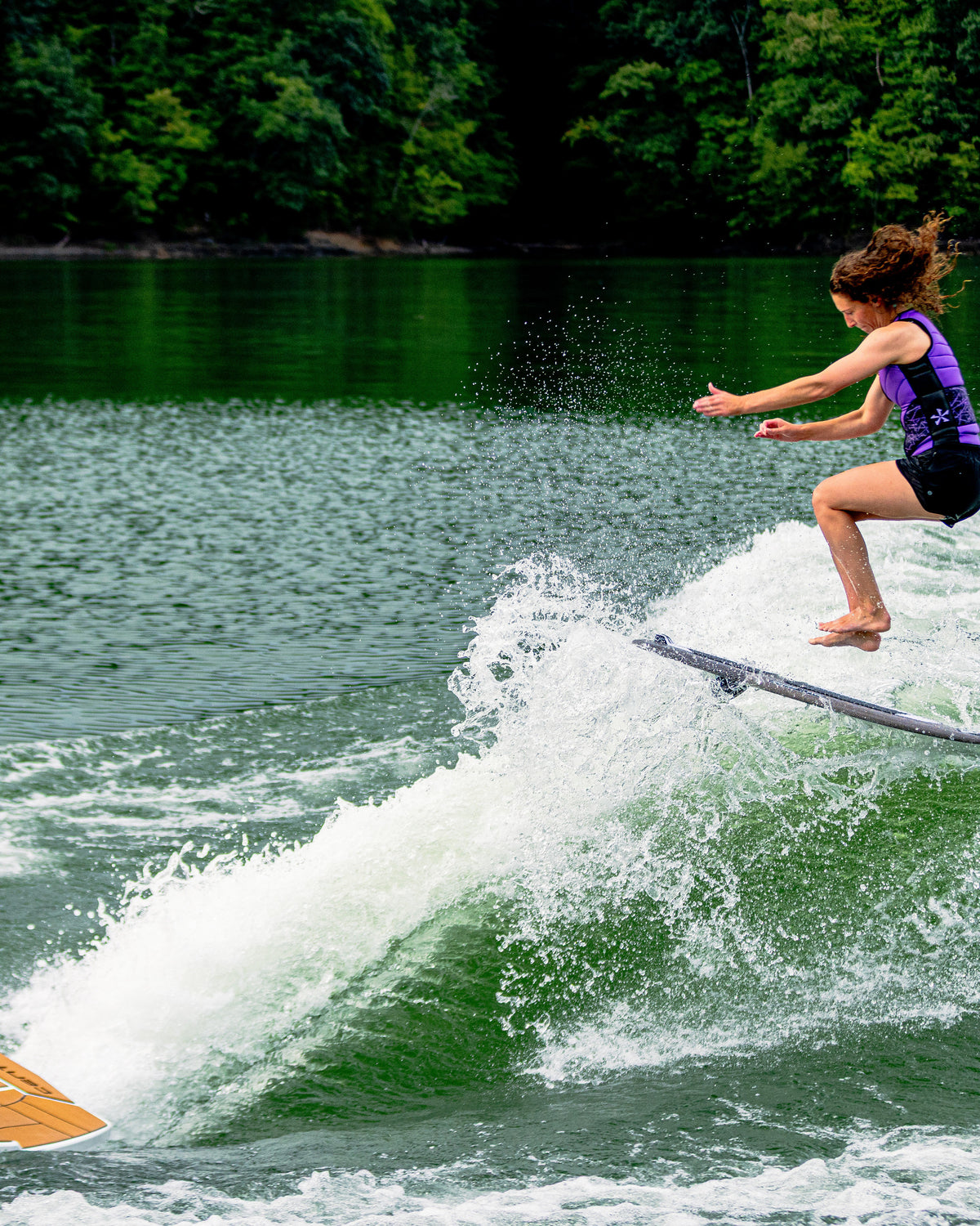 2027 Phase Five Rush Stealth wakesurf board action photo