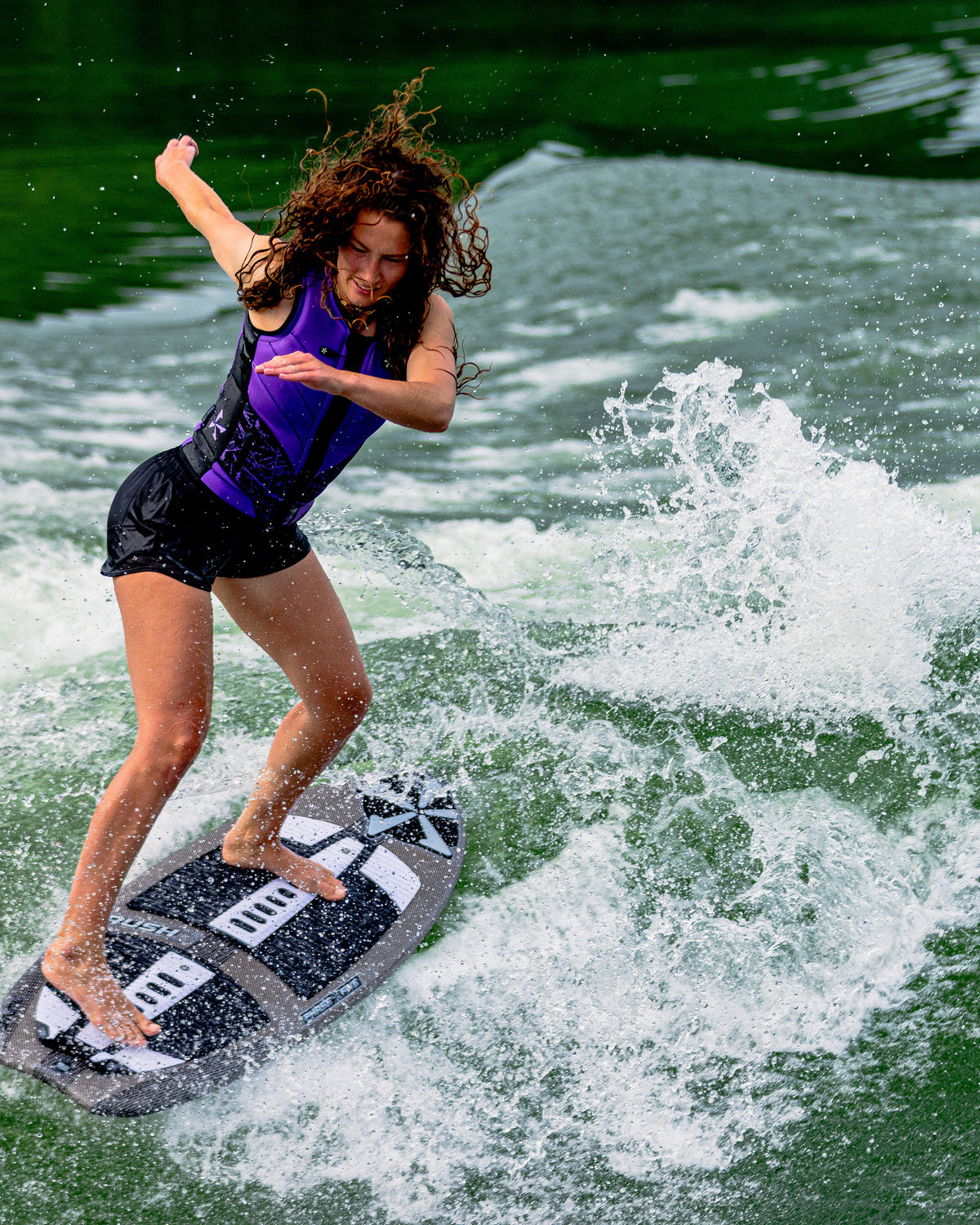 2027 Phase Five Rush Stealth wakesurf board action photo