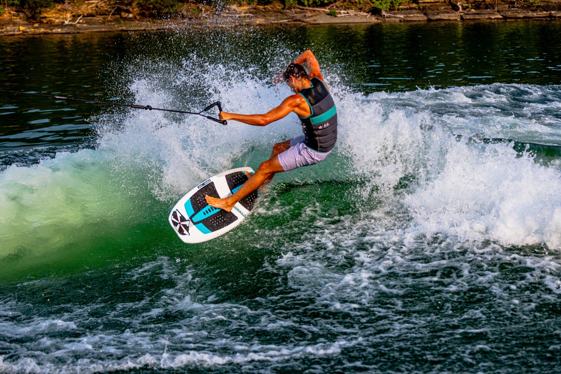 Phase Five rider carving across the wave