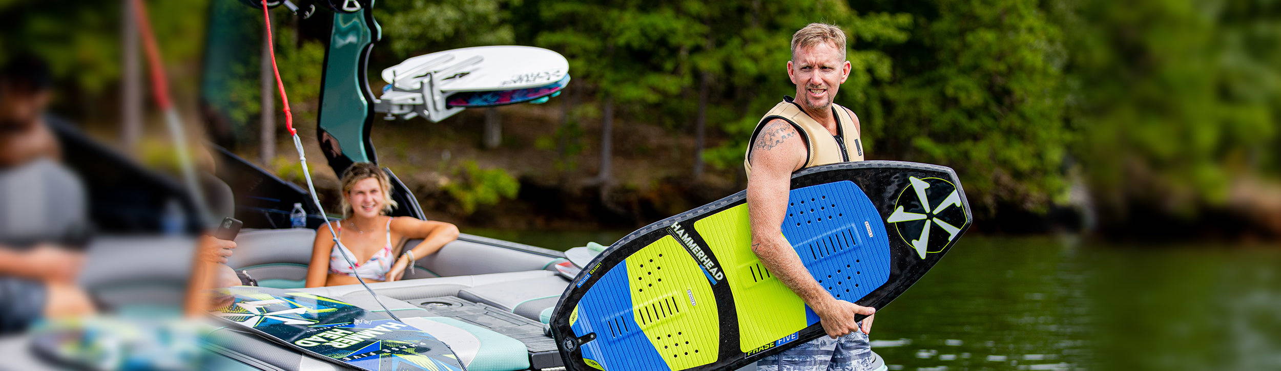 Drew Danielo holding a Phase Five Hammerhead board