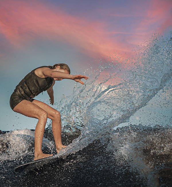 Evie Shropshire wakesurfing on a Phase Five board