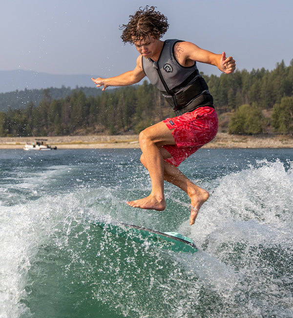 Ryder Duczek wakesurfing on a Phase Five board