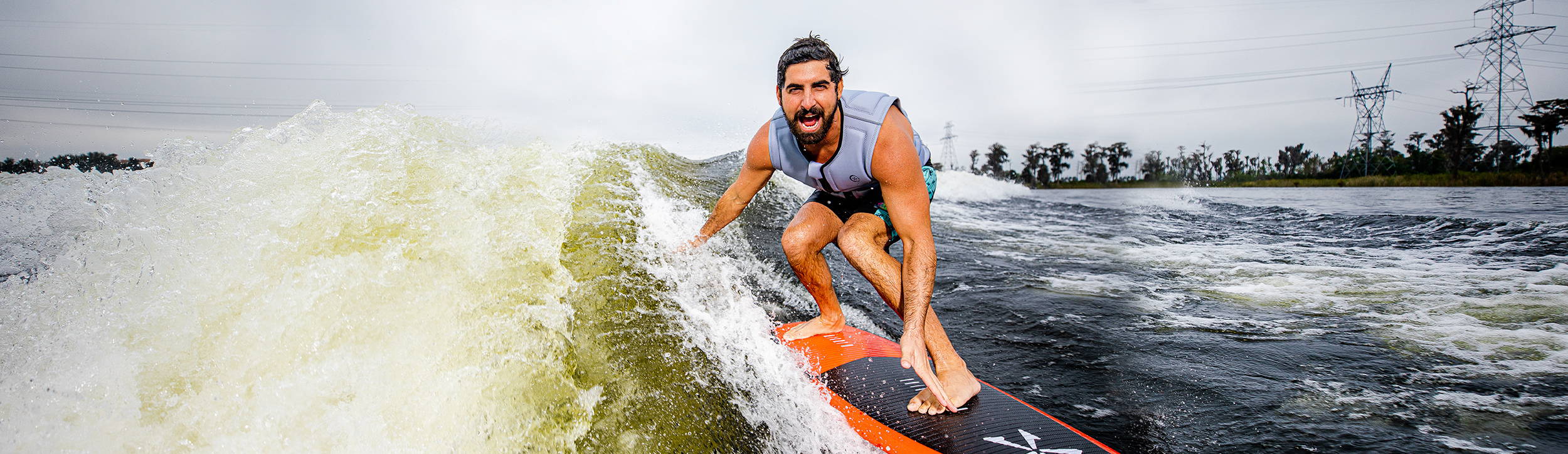 Sean Silveira wakesurfing behind a boat