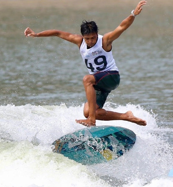 Songkrod Jomboon wakesurfing on a Phase Five board