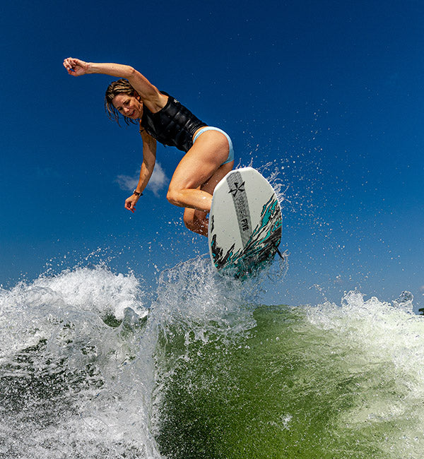 Stacia Bank wakesurfing on a Phase Five Swell board