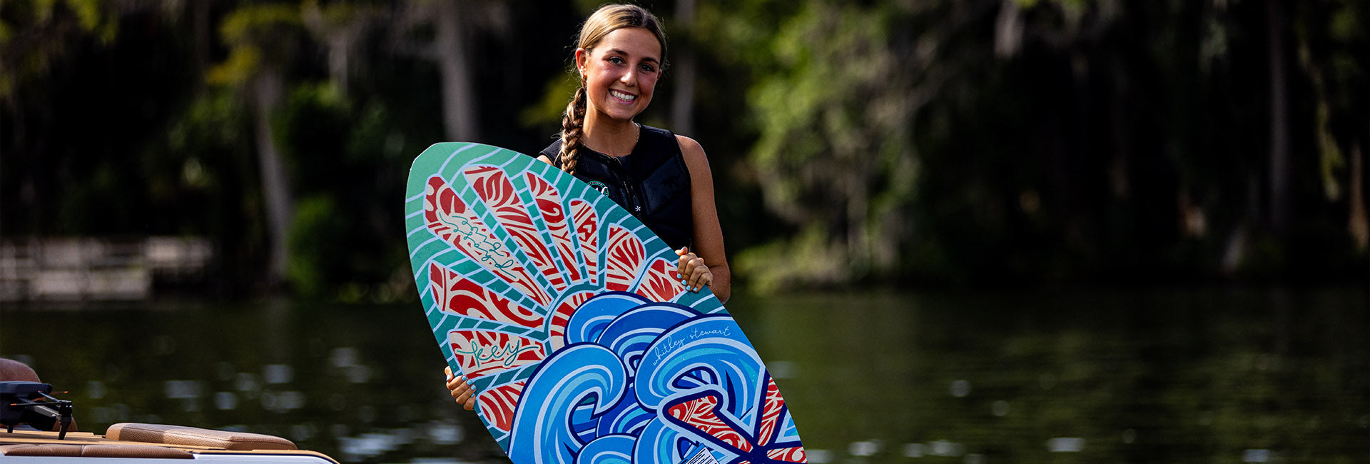 Whitley Stewart holding a Phase Five Key Stewart Pro board